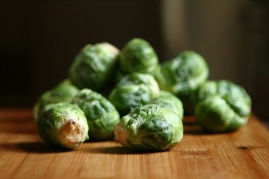 are brussell sprouts ok on a keto diet shallow depth of fields photography of green vegetable on brown wooden panel