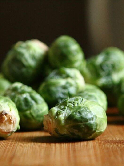 are brussell sprouts ok on a keto diet shallow depth of fields photography of green vegetable on brown wooden panel